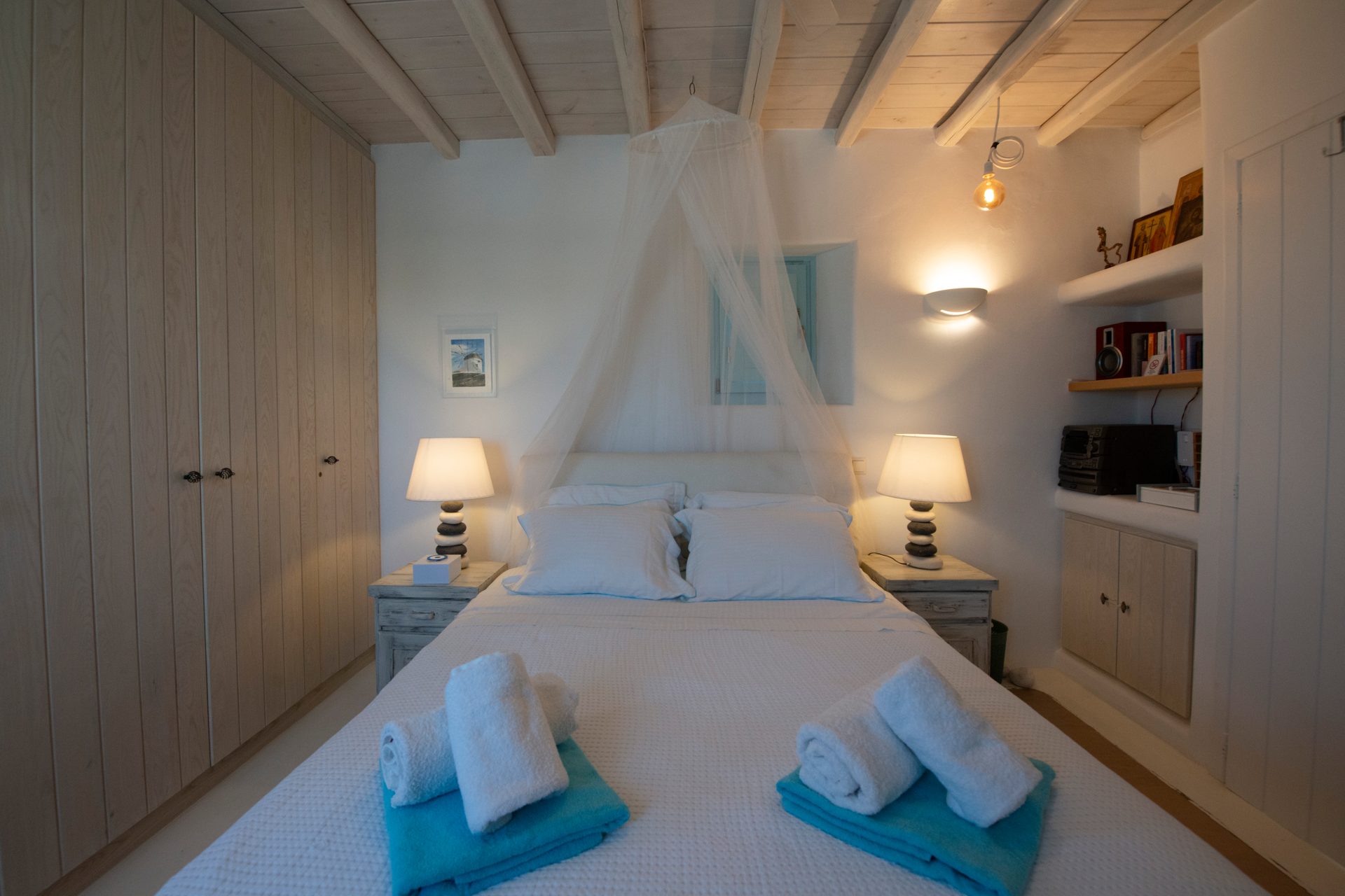 Bedroom with canopy bed at Villa Danelina in Agios Lazaros, Mykonos