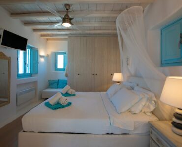 Bedroom with canopy bed at Villa Danelina in Agios Lazaros, Mykonos