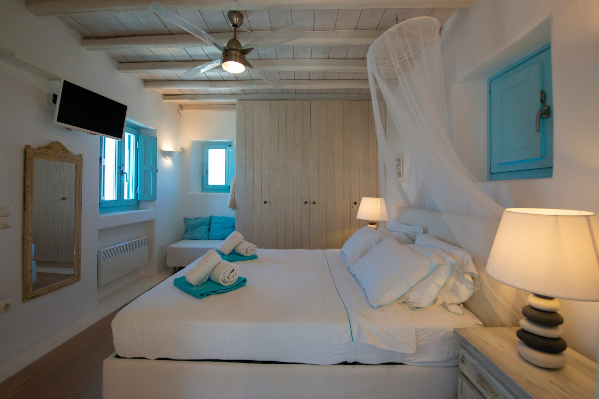 Bedroom with canopy bed at Villa Danelina in Agios Lazaros, Mykonos