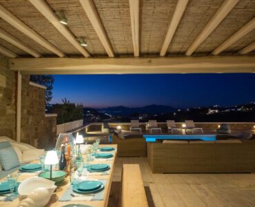 Pergola dining at dusk with sea view at Villa Danelina in Agios Lazaros, Mykonos