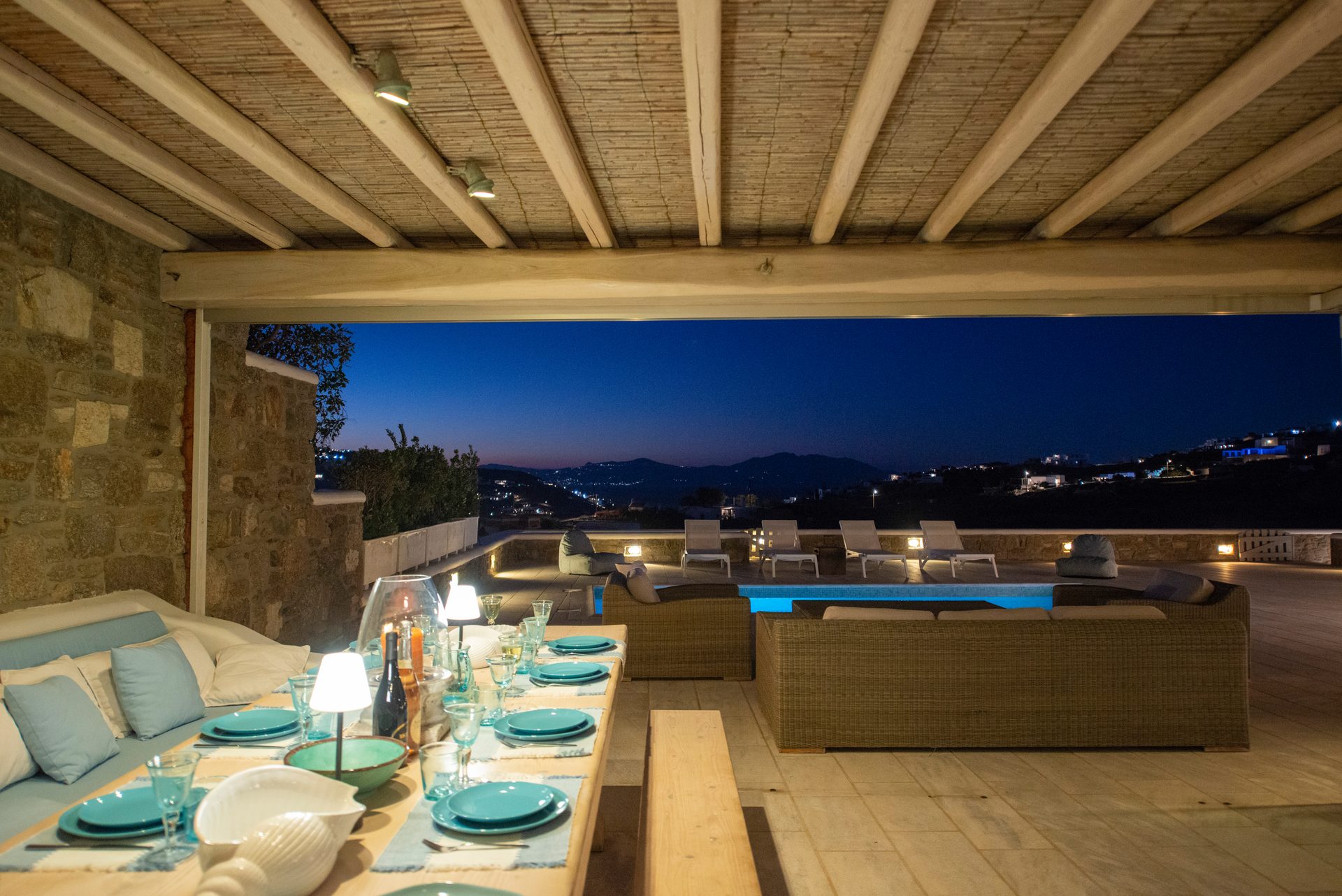 Pergola dining at dusk with sea view at Villa Danelina in Agios Lazaros, Mykonos