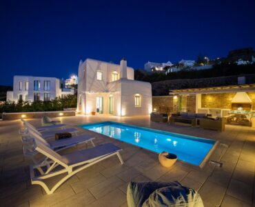 Pool and villa at dusk at Villa Danelina in Agios Lazaros, Mykonos