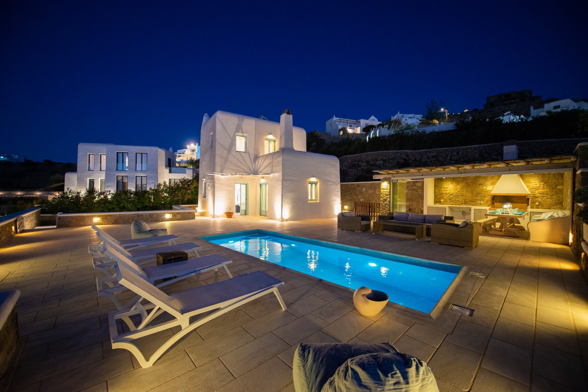 Pool and villa at dusk at Villa Danelina in Agios Lazaros, Mykonos