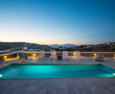 Pool under the sunset sky at Villa Danelina in Agios Lazaros, Mykonos
