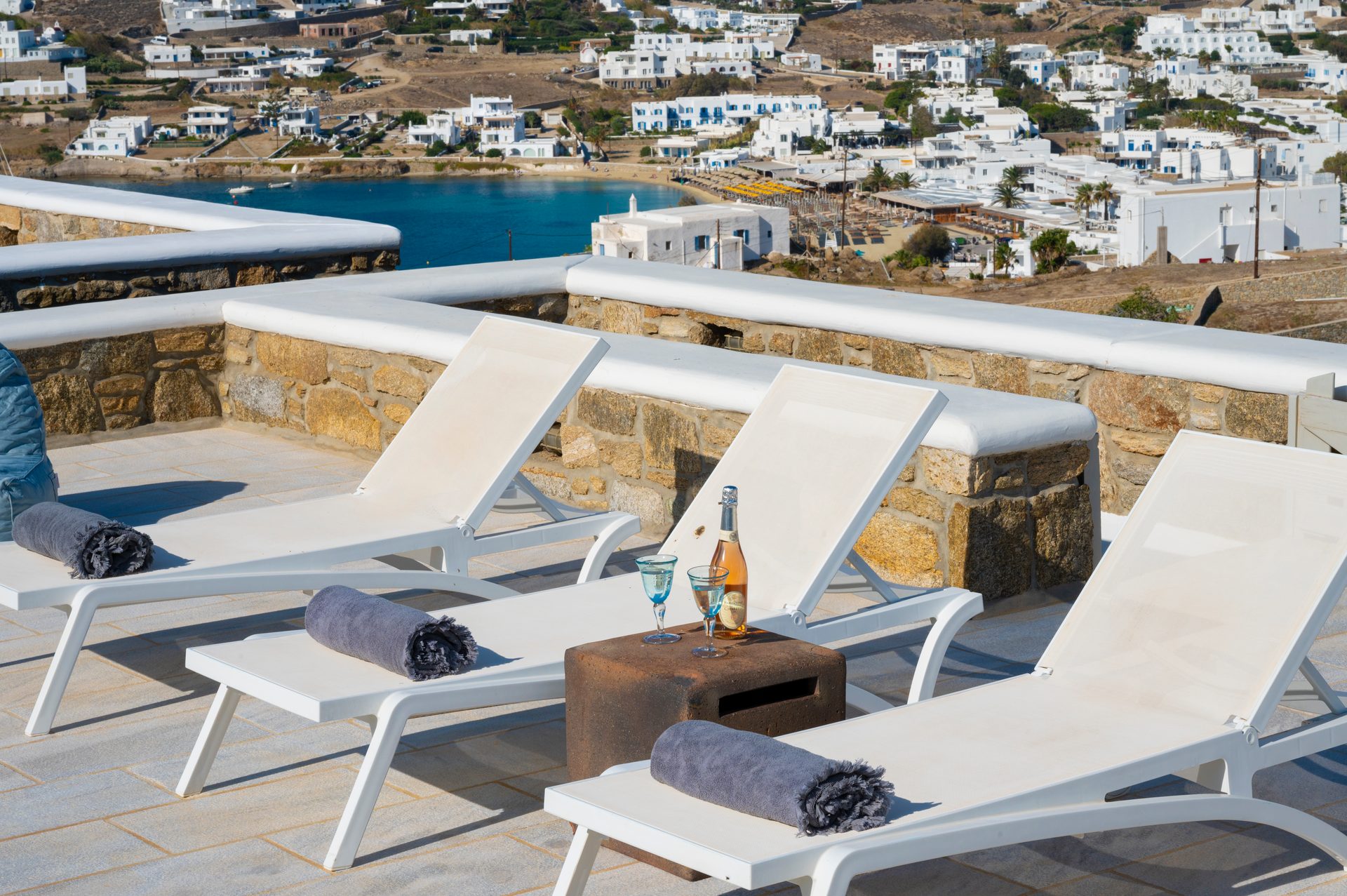 Sun loungers with view over the bay at Villa Danelina in Agios Lazaros, Mykonos