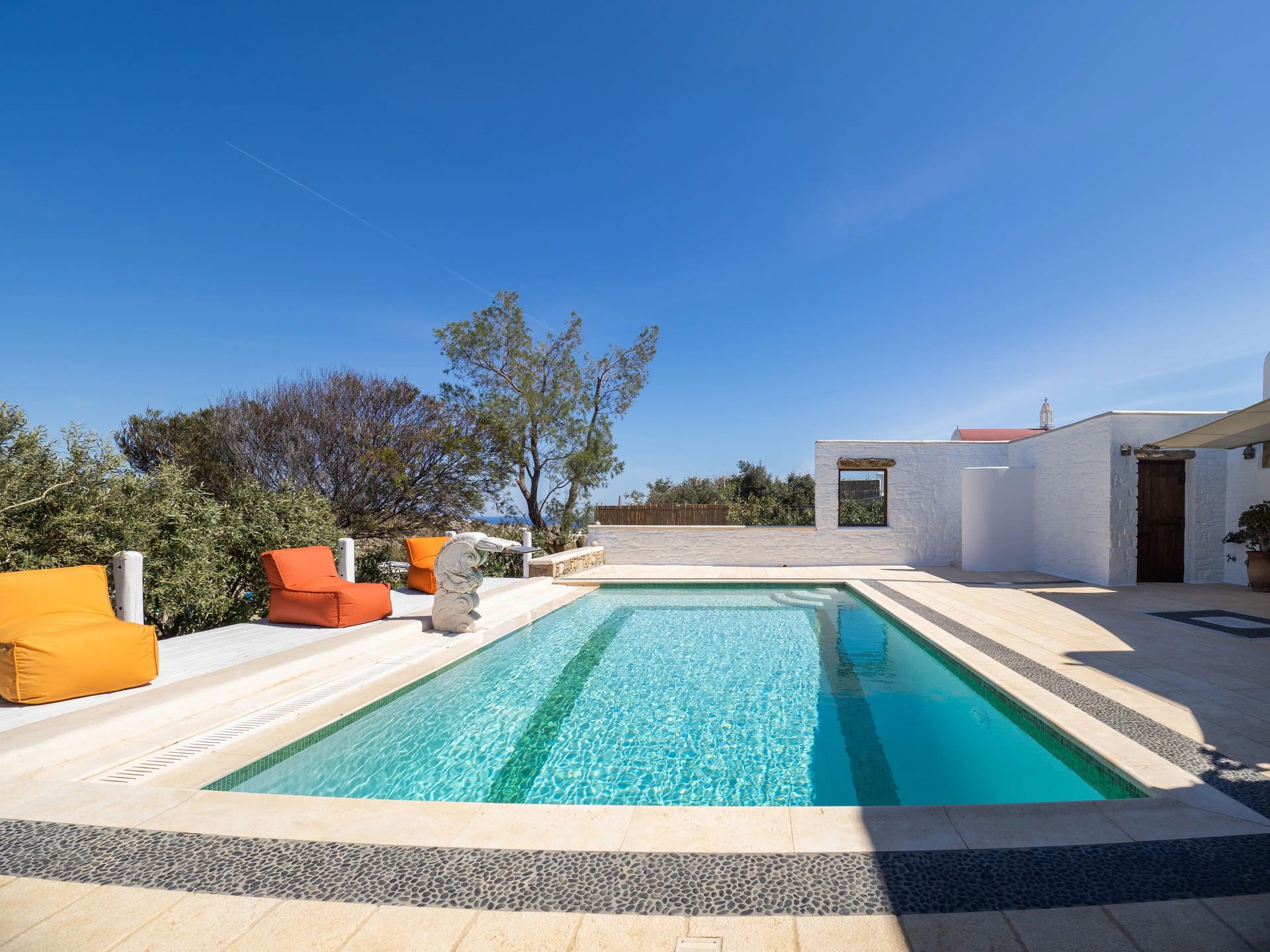 Pool and garden at Villa Gaia in Psarou, Mykonos