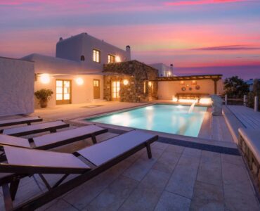 Pool terrace at sunset at Villa Gaia in Psarou, Mykonos