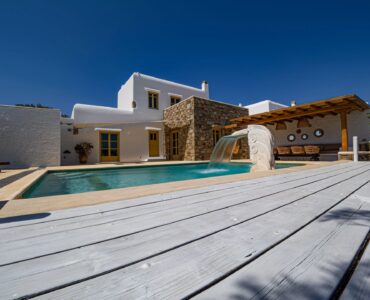 Pool and wooden pergola at Villa Gaia in Psarou, Mykonos