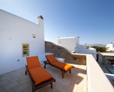 Sun loungers on the upper terrace at Villa Gaia in Psarou, Mykonos