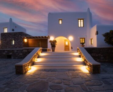 Entrance steps lit at dusk at Villa Gaia in Psarou, Mykonos