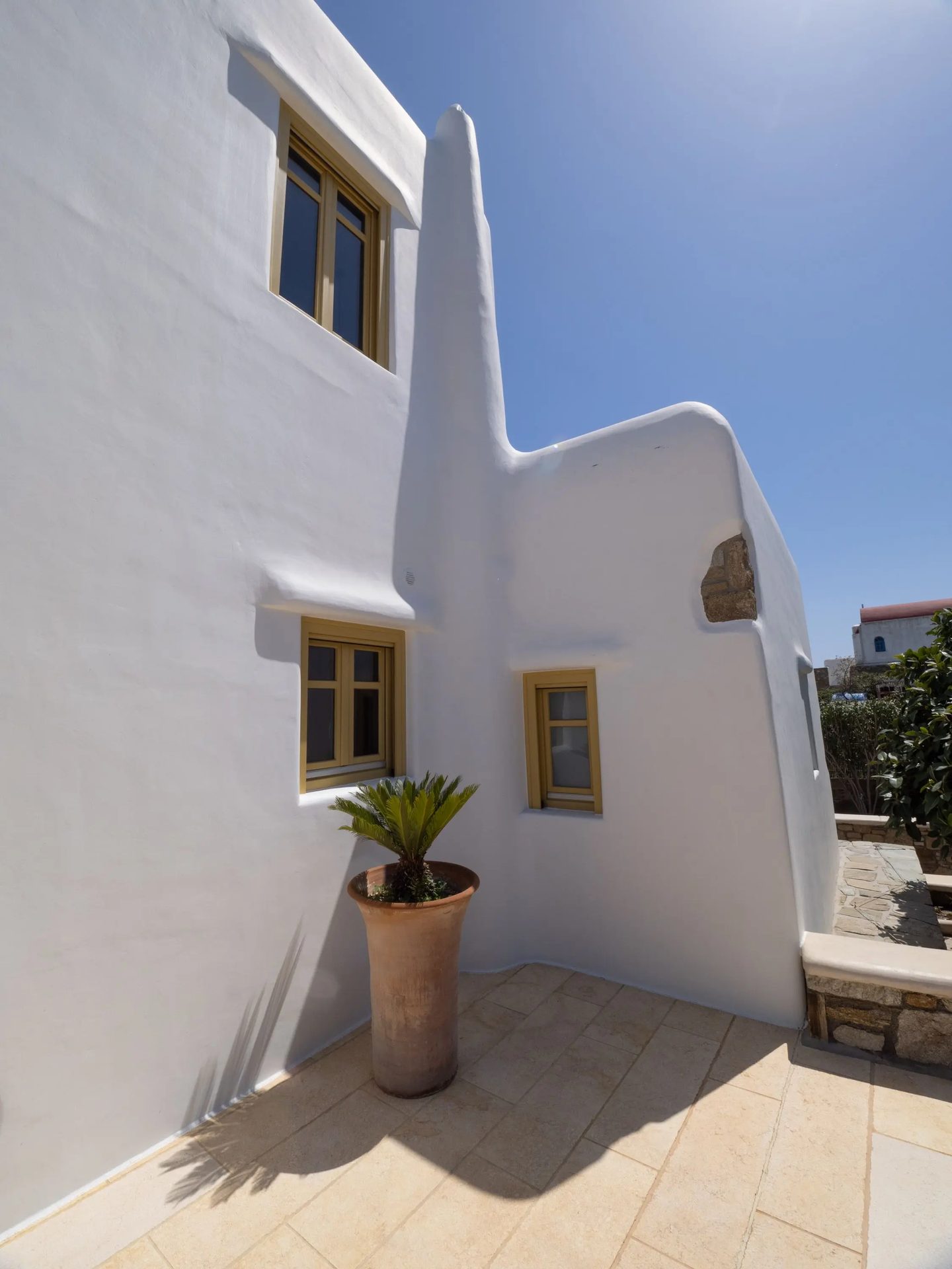 Whitewashed exterior detail at Villa Gaia in Psarou, Mykonos