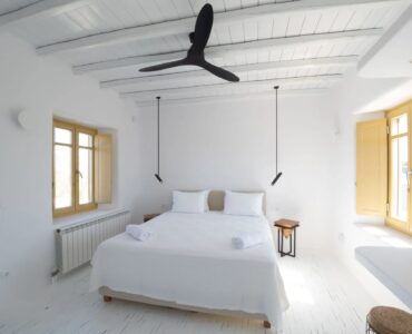 Double bedroom with ceiling fan at Villa Gaia in Psarou, Mykonos