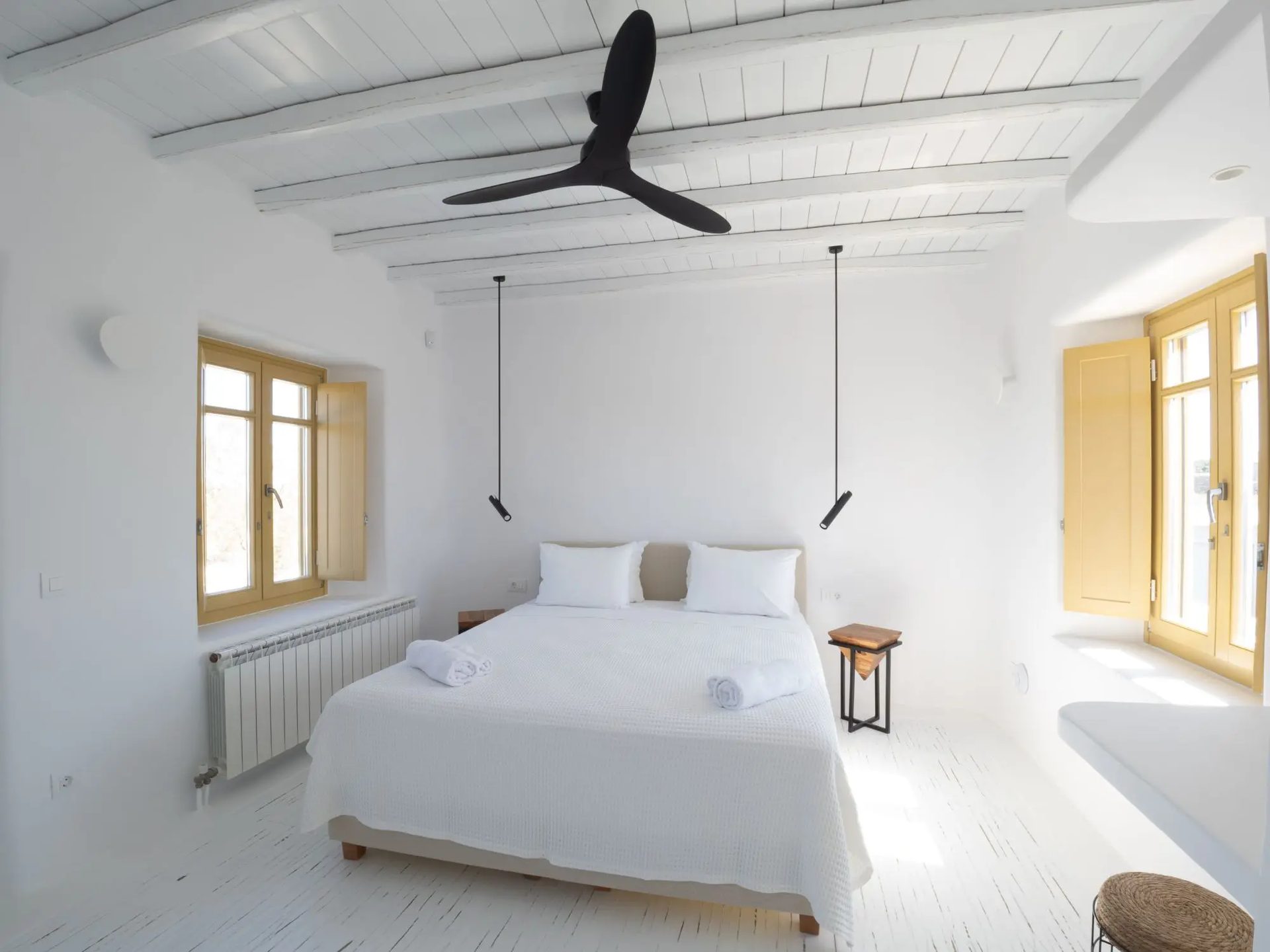 Double bedroom with ceiling fan at Villa Gaia in Psarou, Mykonos