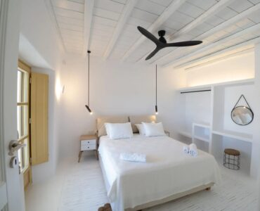 Double bedroom with ceiling fan at Villa Gaia in Psarou, Mykonos