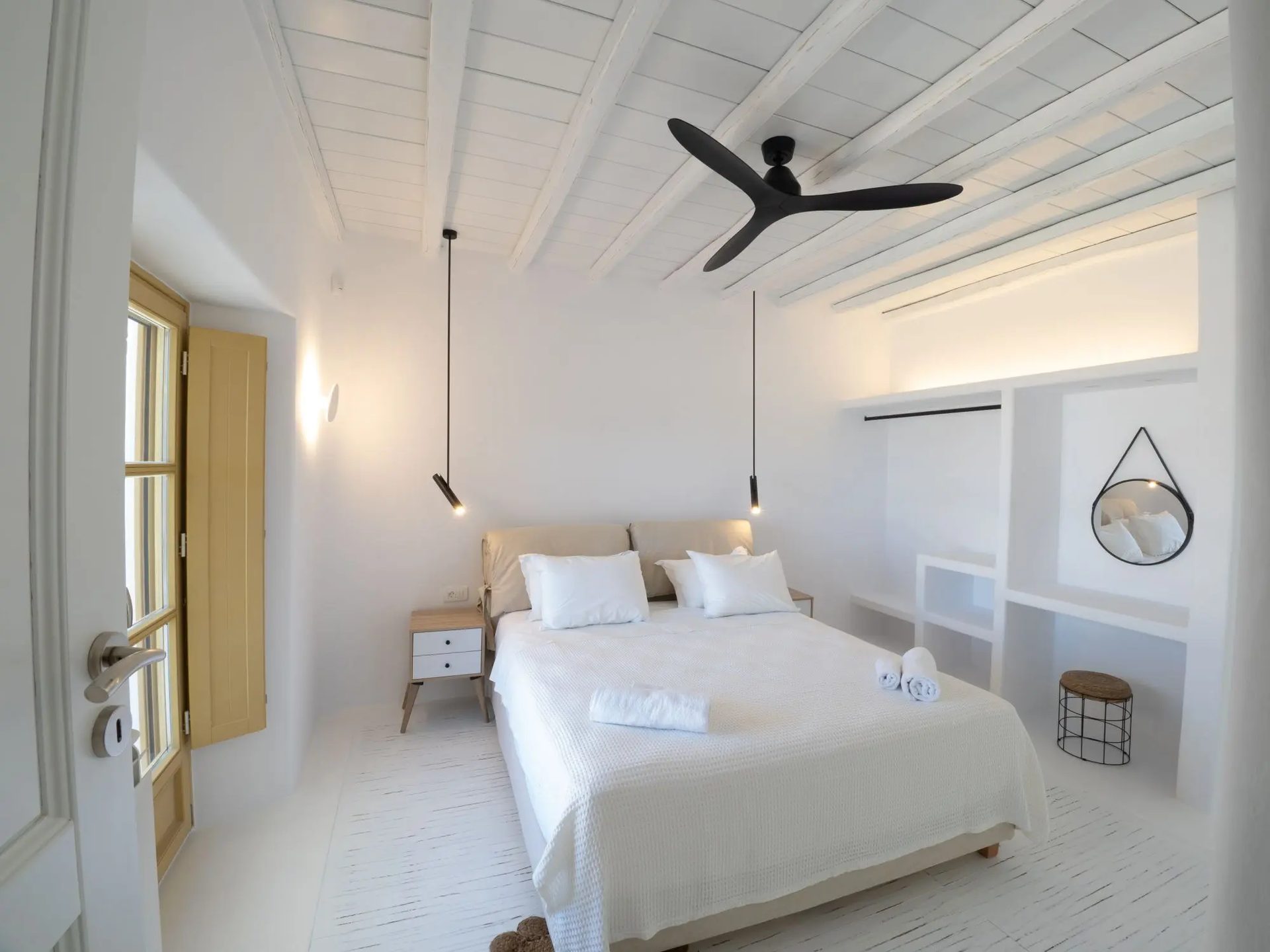 Double bedroom with ceiling fan at Villa Gaia in Psarou, Mykonos