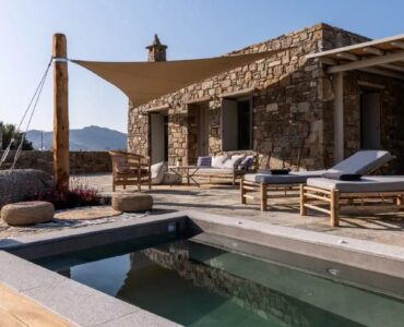 Private heated jacuzzi beside the stone house at Villa Kele in Ftelia, Mykonos
