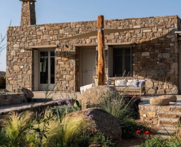 Stone facade and garden at Villa Kele in Ftelia, Mykonos