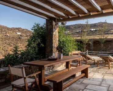 Pergola dining area with countryside views at Villa Kele in Ftelia, Mykonos
