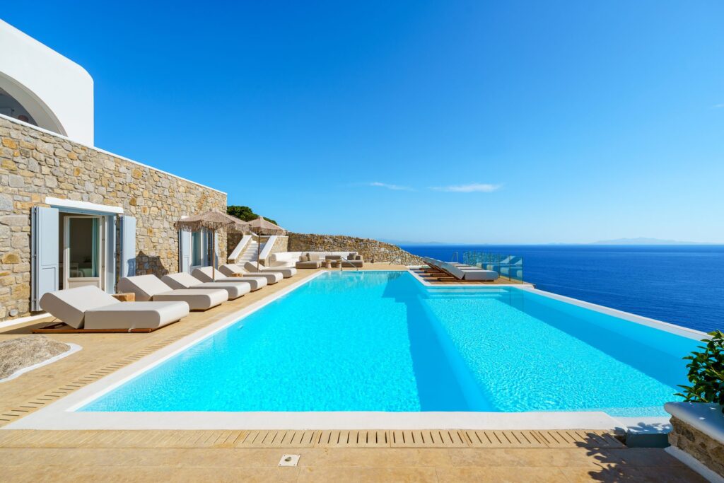 Infinity pool and the Aegean Sea at Villa Kymothea in Agios Lazaros, Mykonos