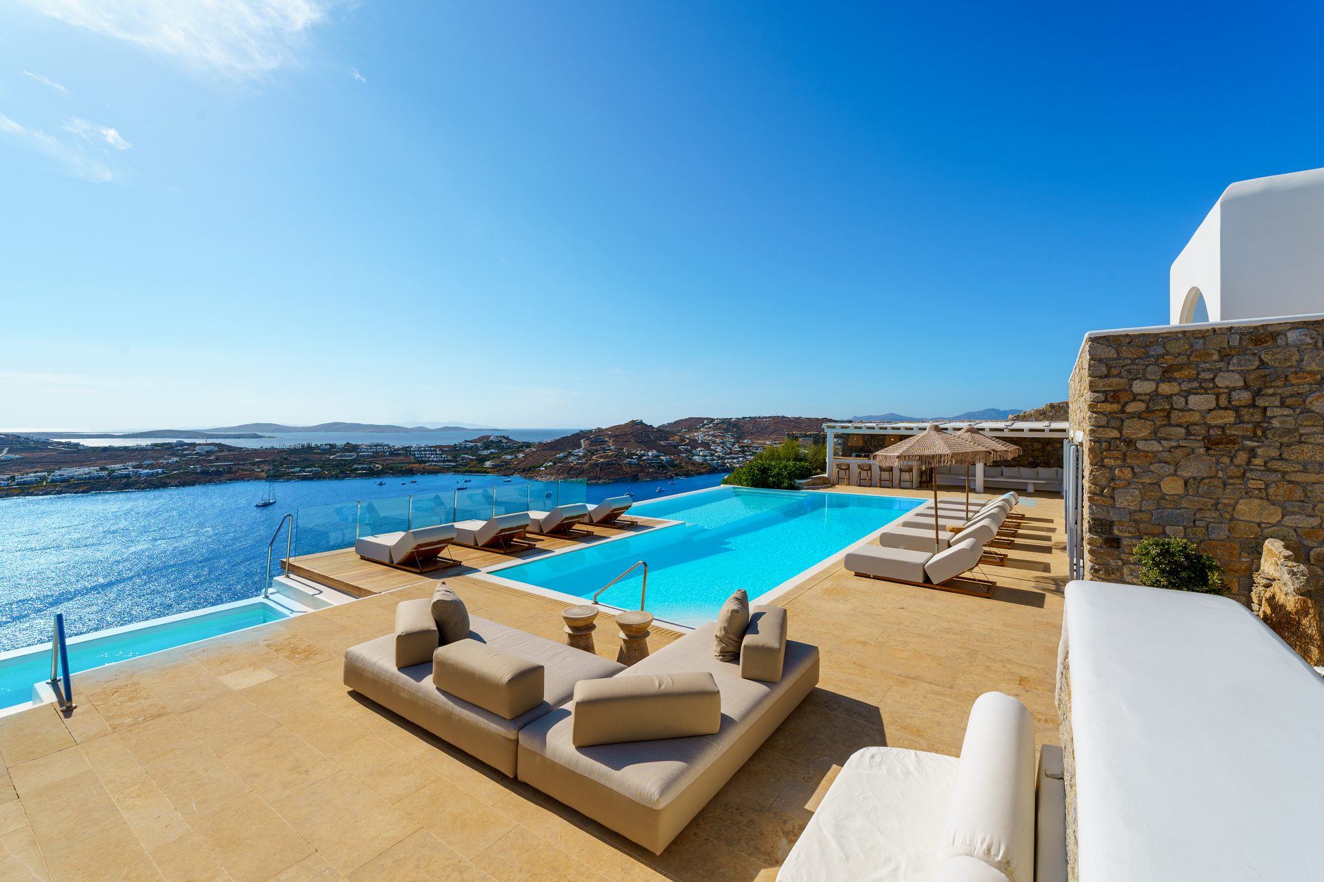 Lounge by the pool at Villa Kymothea in Agios Lazaros, Mykonos