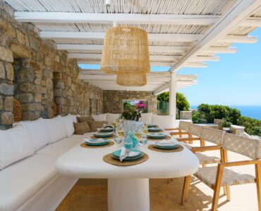 Outdoor dining under the pergola at Villa Kymothea in Agios Lazaros, Mykonos