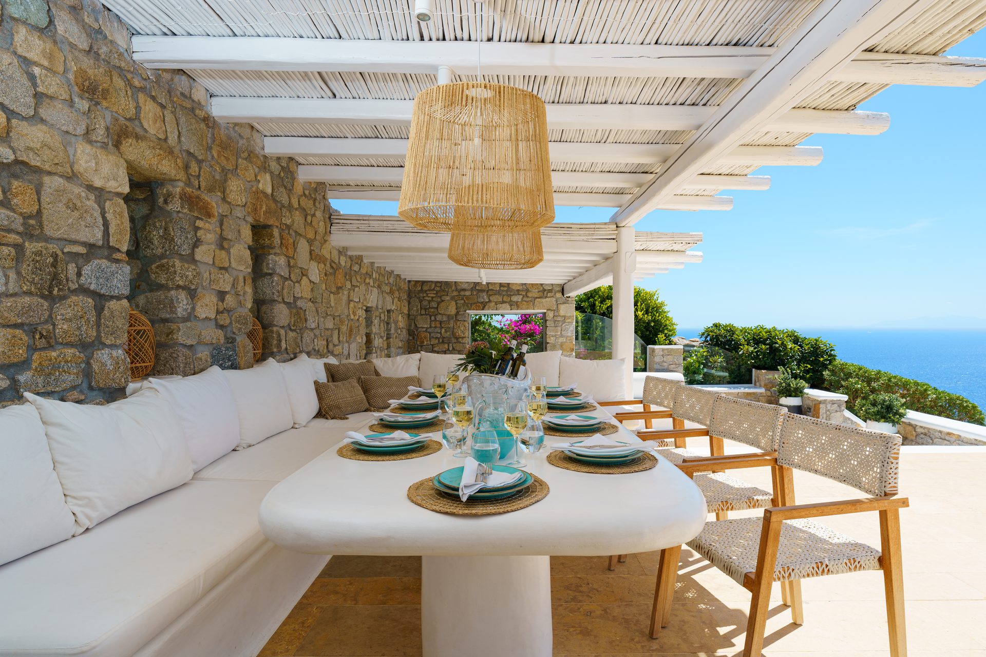Outdoor dining under the pergola at Villa Kymothea in Agios Lazaros, Mykonos