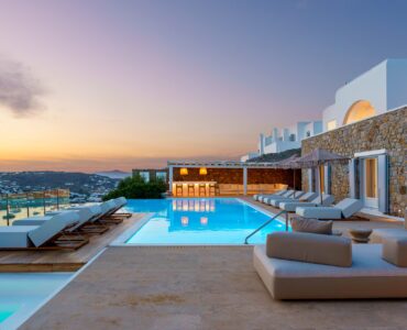 Pool and lounge at dusk at Villa Kymothea in Agios Lazaros, Mykonos