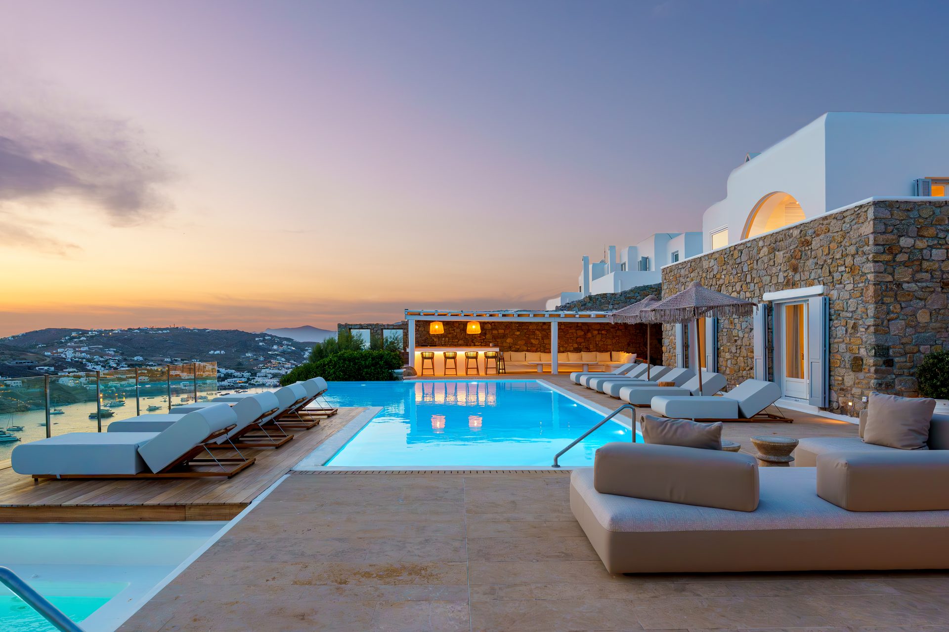 Pool and lounge at dusk at Villa Kymothea in Agios Lazaros, Mykonos