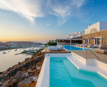 Pool and terraces towards Ornos at Villa Kymothea in Agios Lazaros, Mykonos
