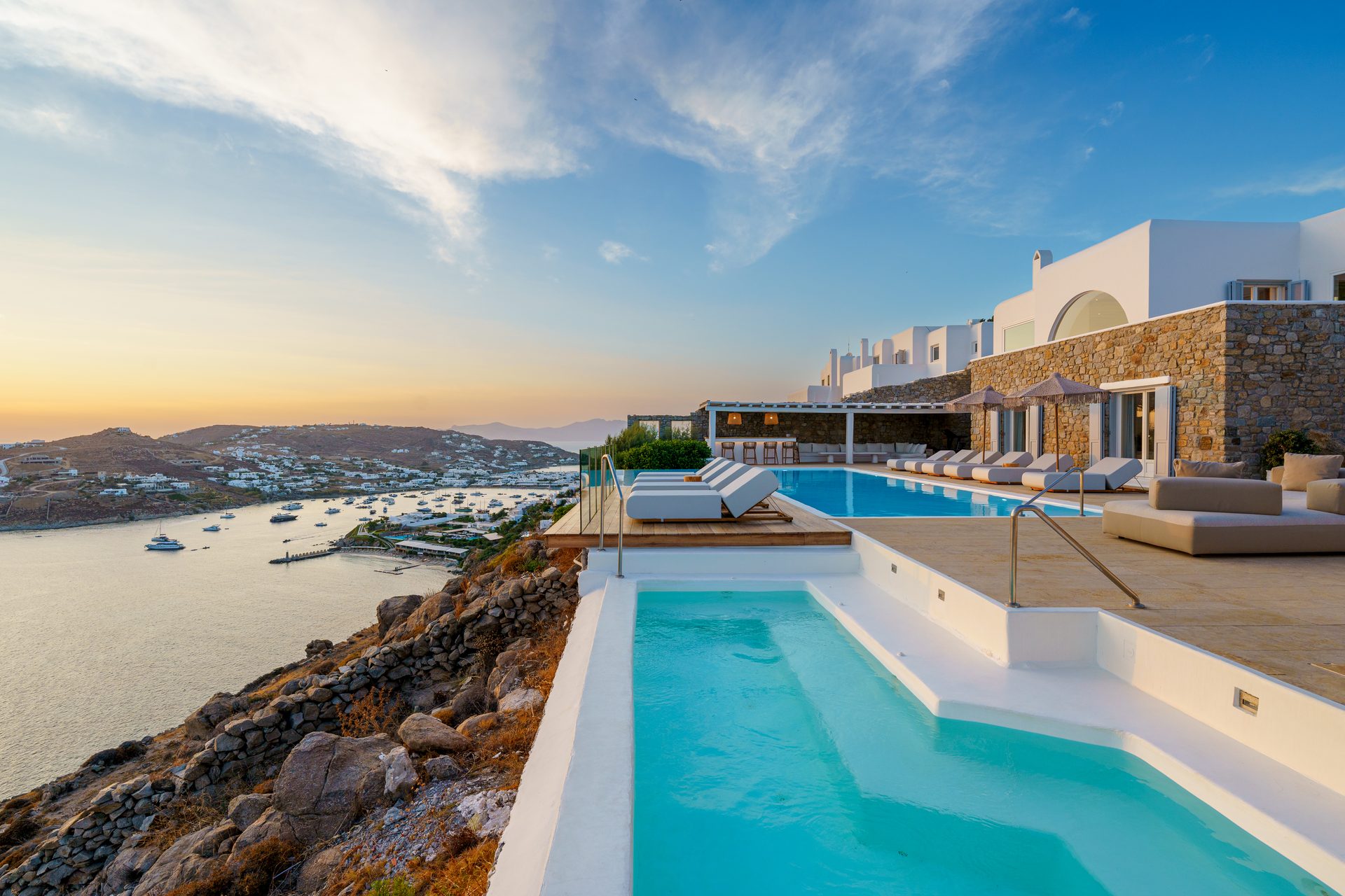Pool and terraces towards Ornos at Villa Kymothea in Agios Lazaros, Mykonos
