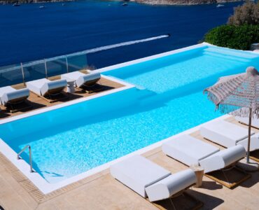 Pool with sun loungers and parasol at Villa Kymothea in Agios Lazaros, Mykonos