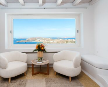 Sitting area with picture window at Villa Kymothea in Agios Lazaros, Mykonos