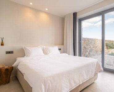 Bedroom with sea-view window at Villa Mare Blu in Kanalia, Mykonos