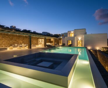 Pool lit at dusk at Villa Mare Blu in Kanalia, Mykonos