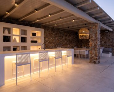 Covered outdoor bar at dusk at Villa Mare Blu in Kanalia, Mykonos