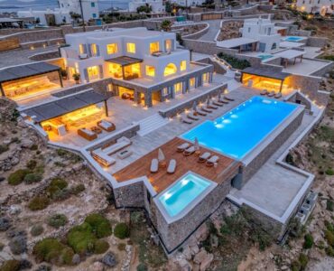 Aerial view of Villa Nafsithoi at dusk in Agios Lazaros, Mykonos
