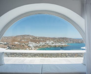 Arched window with view at Villa Nafsithoi in Agios Lazaros, Mykonos