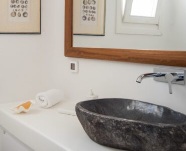 Bathroom with stone basin at Villa Nafsithoi in Agios Lazaros, Mykonos