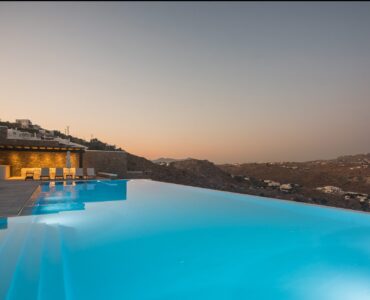 Infinity pool at dusk at Villa Nafsithoi in Agios Lazaros, Mykonos
