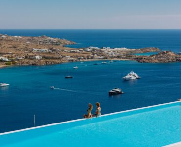 Infinity pool overlooking Psarou bay at Villa Nafsithoi in Agios Lazaros, Mykonos