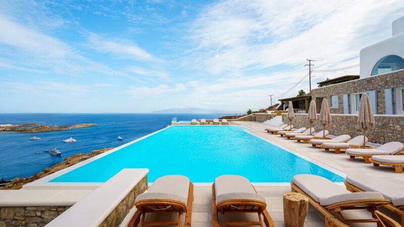 Infinity pool with sun loungers at Villa Nafsithoi in Agios Lazaros, Mykonos