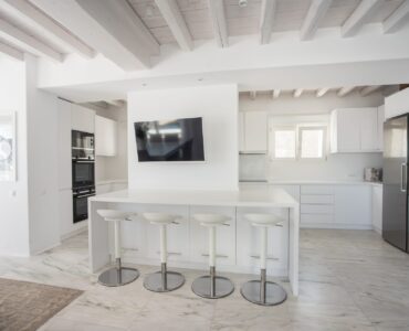 Kitchen with centre island at Villa Nafsithoi in Agios Lazaros, Mykonos