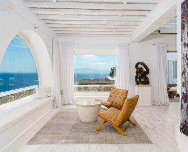 Lounge with arched windows at Villa Nafsithoi in Agios Lazaros, Mykonos