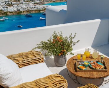 Terrace with fruit platter and sea view at Villa Nafsithoi in Agios Lazaros, Mykonos