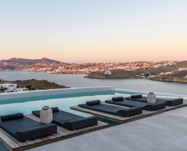 Pool terrace at sunset at Villa Nerovino in Kanalia, Mykonos