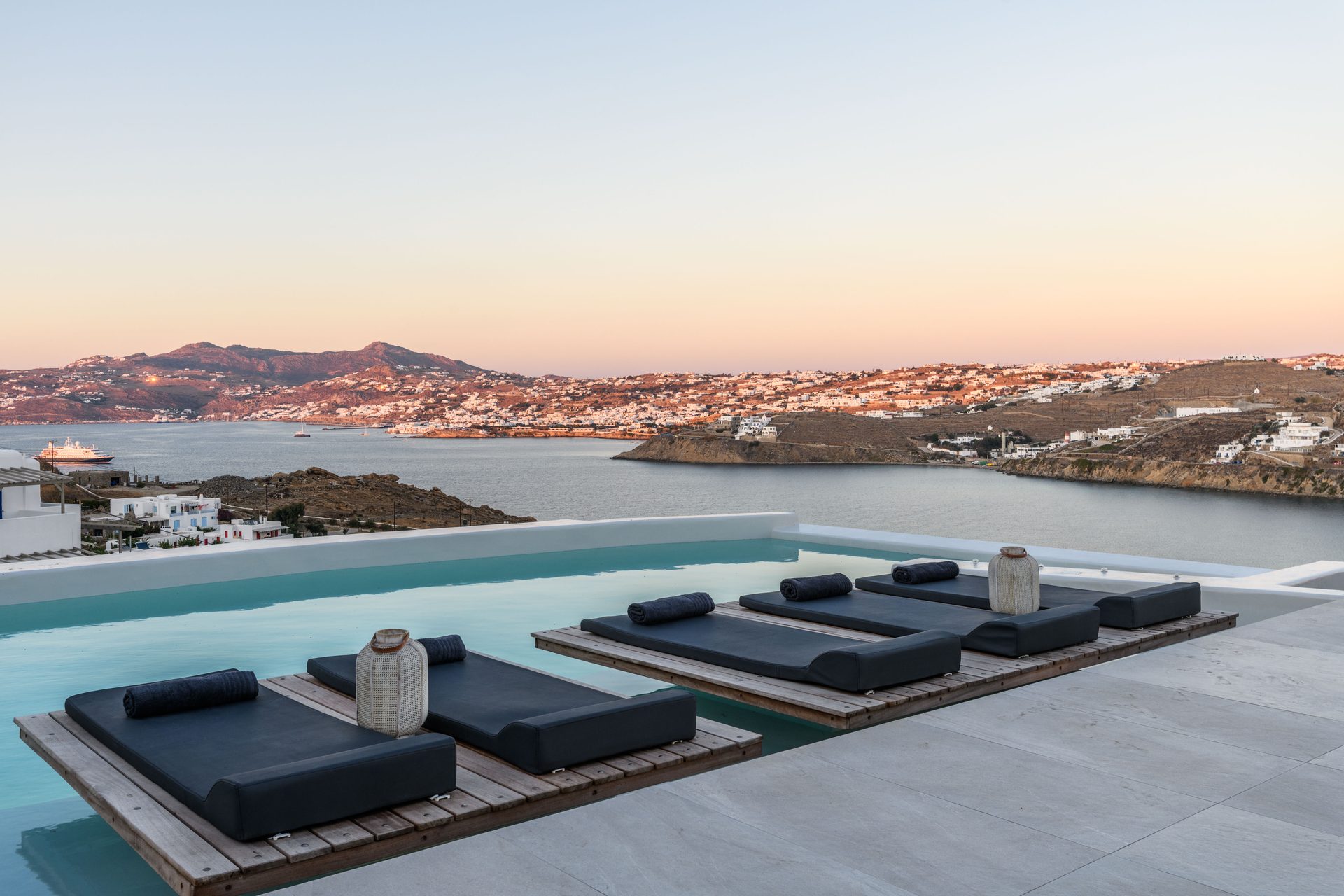 Pool terrace at sunset at Villa Nerovino in Kanalia, Mykonos