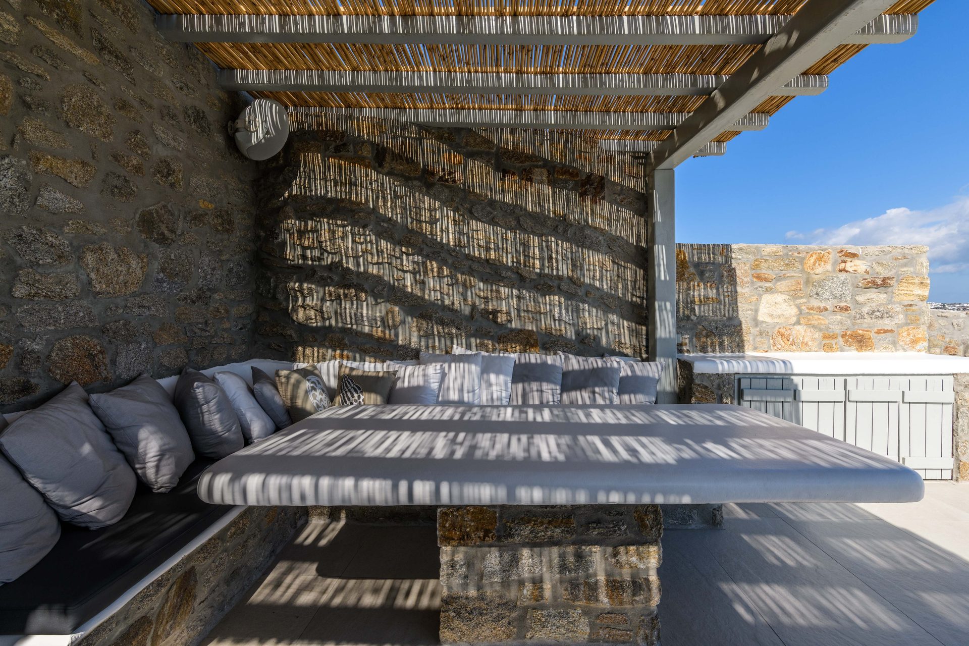 Covered outdoor lounge at Villa Nerovino in Kanalia, Mykonos