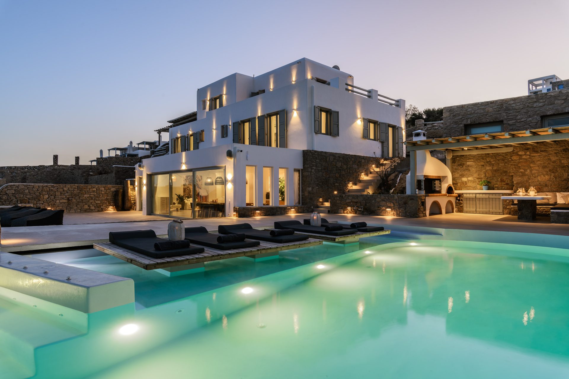 Villa and pool at dusk at Villa Nerovino in Kanalia, Mykonos