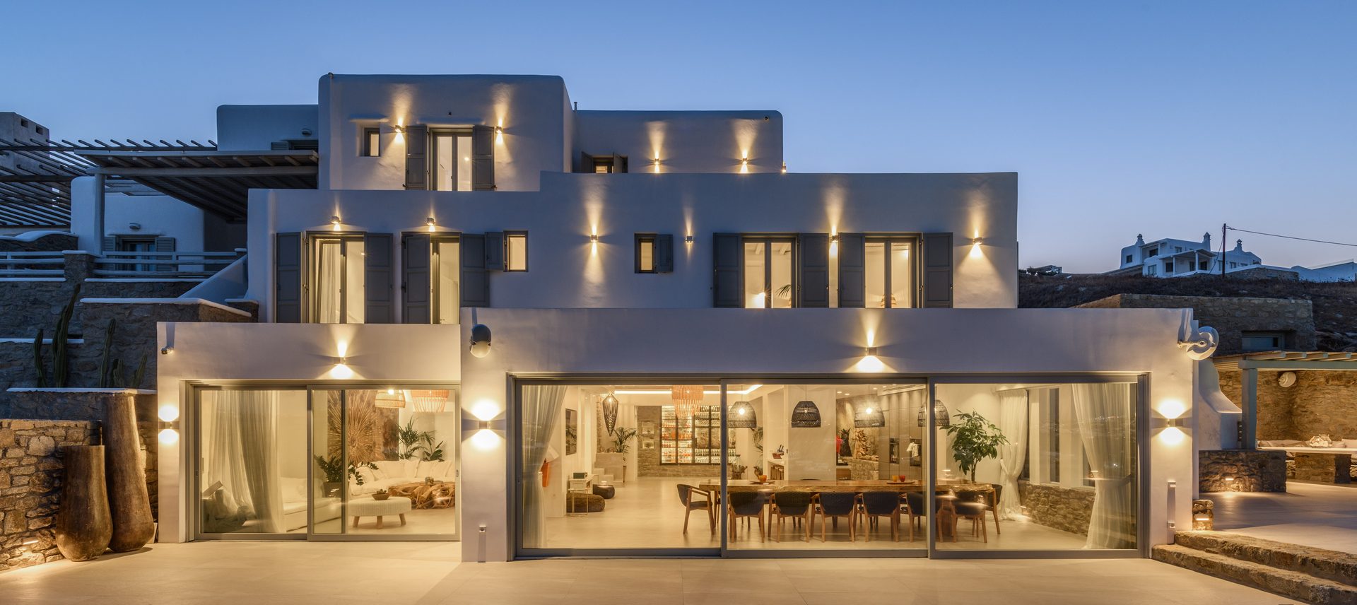 Villa lit at dusk at Villa Nerovino in Kanalia, Mykonos