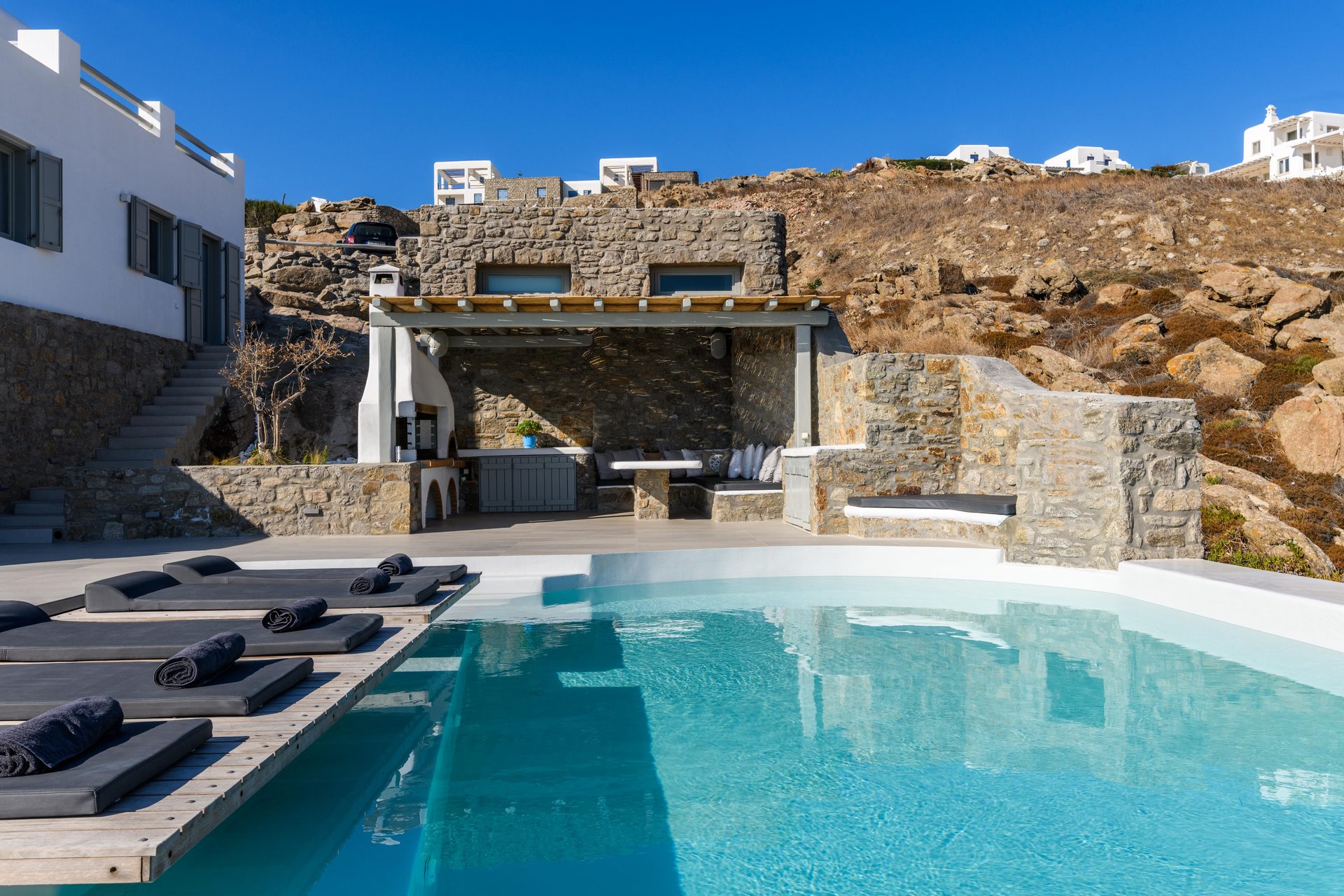 Pool and stone terraces at Villa Nerovino in Kanalia, Mykonos